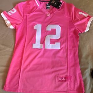 NFL Nike never worn pink Aaron Rodgers jersey.Fits like a women’s medium!